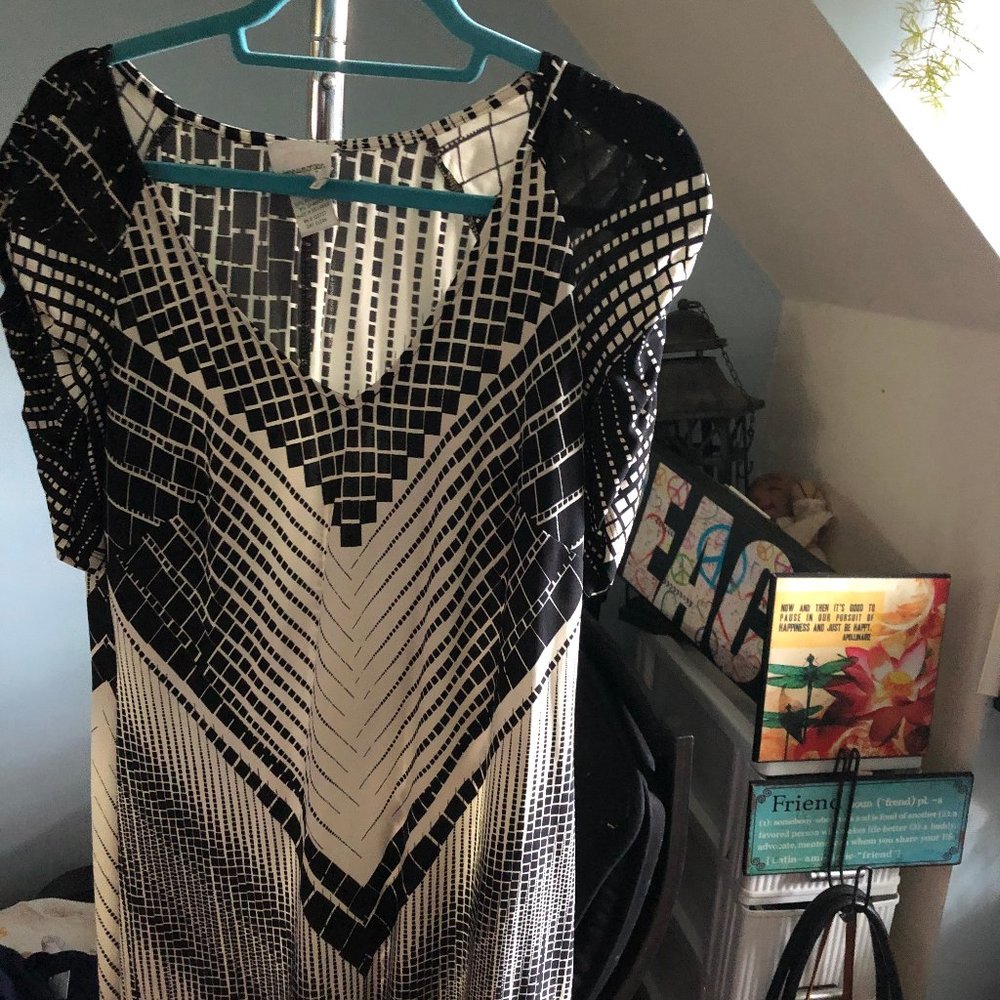 Unique design dress; silky feel; flows; lays nice